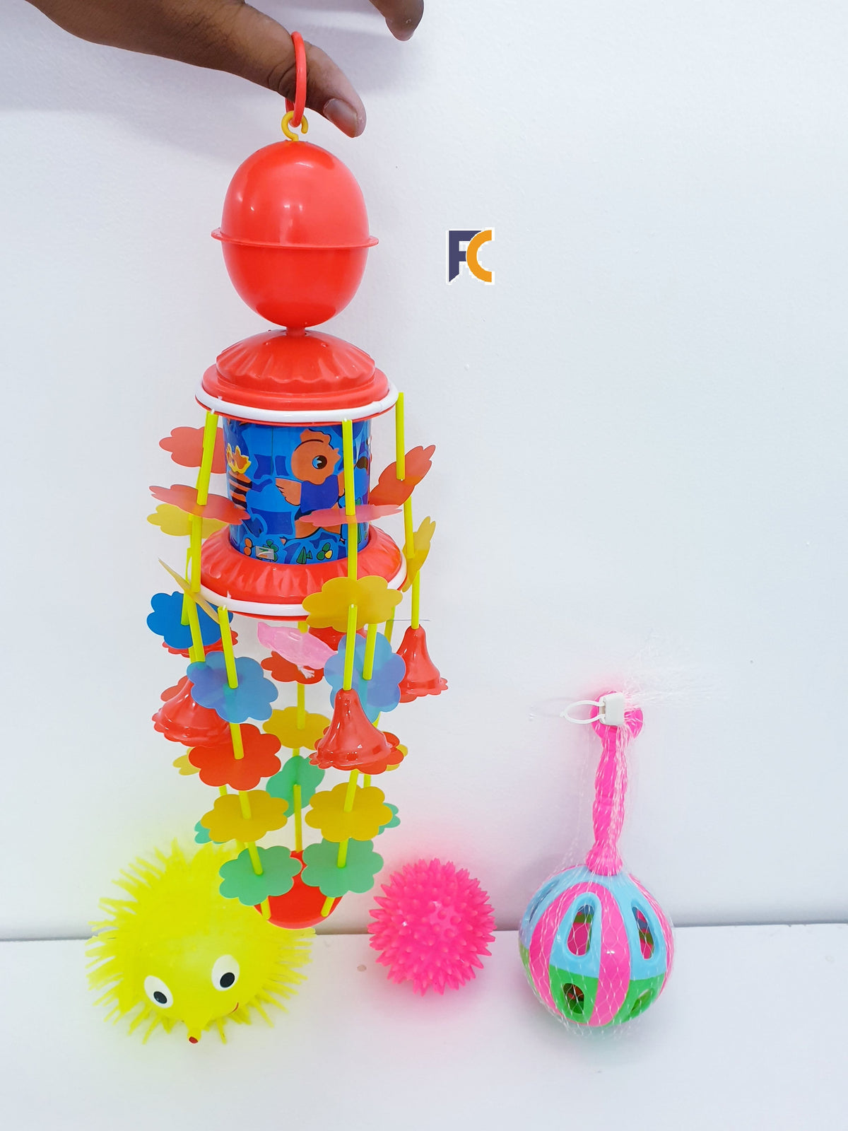 Combo packfor babies  1 Lighting Puffer Soft Ball Rubber  1 Spiky Massage Ball 1 Rotating Bed Bell Toy with Music -Red color 1 JUNJUNI TOY