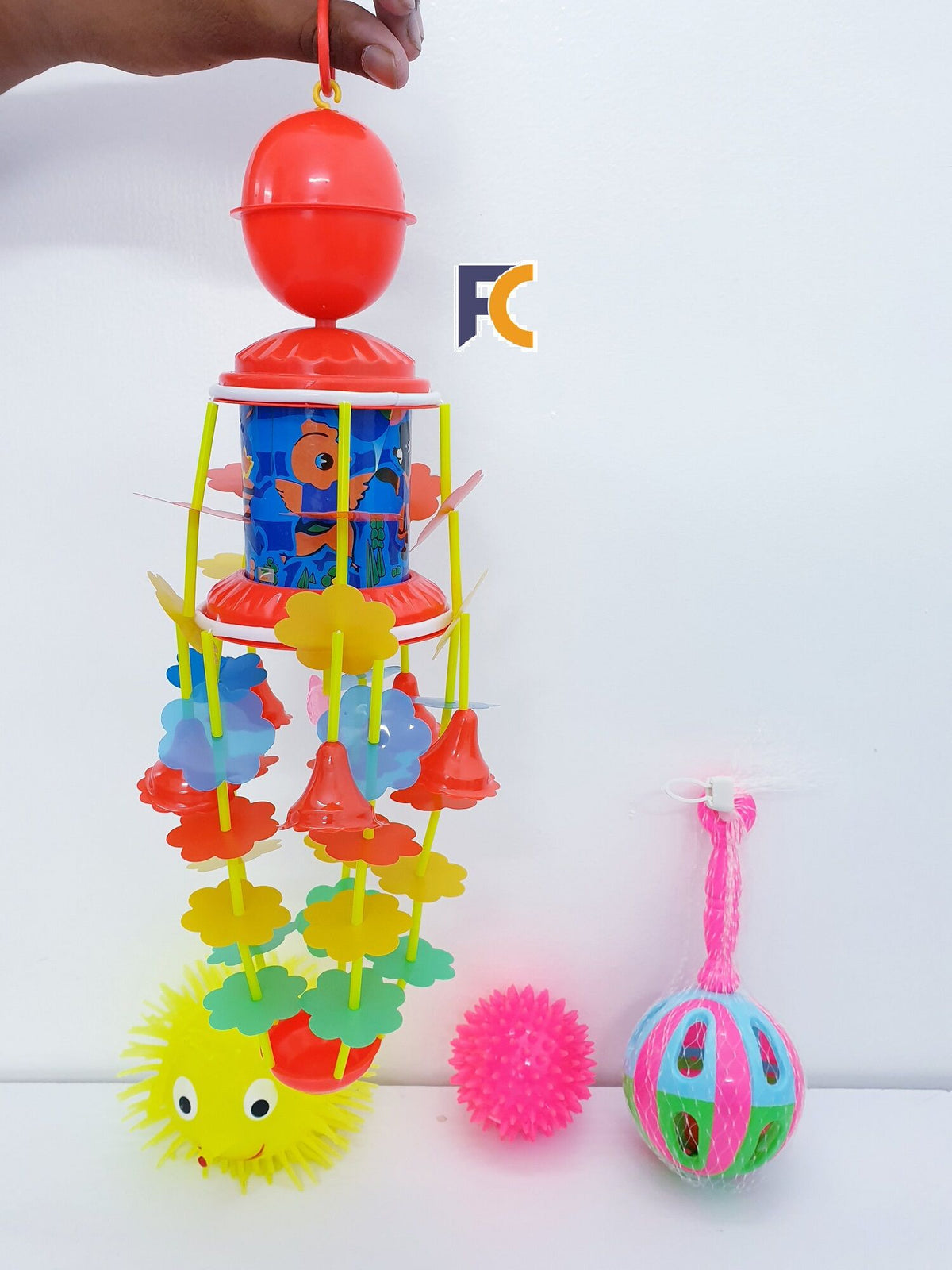 Combo packfor babies  1 Lighting Puffer Soft Ball Rubber  1 Spiky Massage Ball 1 Rotating Bed Bell Toy with Music -Red color 1 JUNJUNI TOY